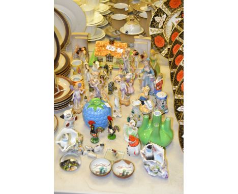 A Burleigh Ware ' Cottage' butter dish and cover; a pair of Continental porcelain bookends; models of terriers; a pair of ear