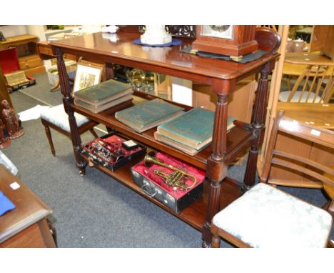 A George IV mahogany buffet, the serpentine cresting pierced with fretwork above three moulded rectangular tiers, fluted supp