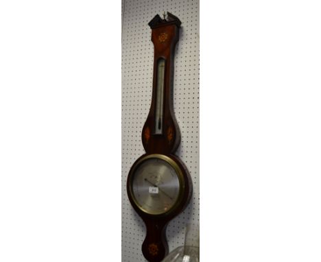 A late 19th/early 20th century mahogany wheel barometer, the 20cm silvered dial inscribed Basehga, Preston, alcohol thermomet