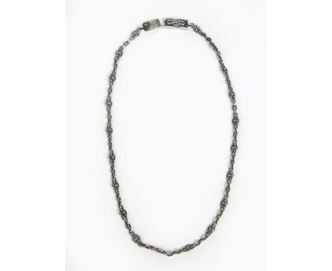 A silver link necklace the designed attributed to Omar Ramsden, panels of Celtic Knot links with simple link chain spacers,  