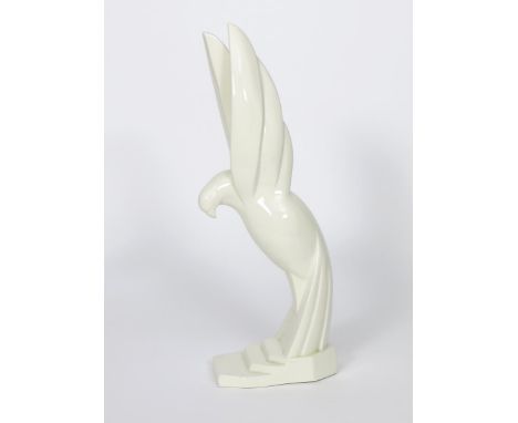 Le Pigeon S'Envole a ceramic bird sculpture by Jacques Adnet, on stepped base, covered in a cream white glaze, impressed Adne