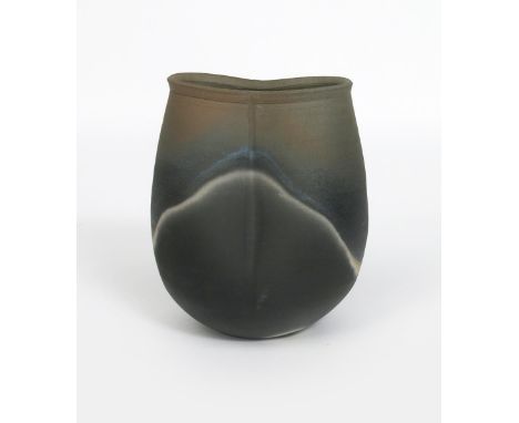 John Leach (born 1939) a Muchelney Pottery raku vase dated 1995, compressed ovoid form with incised vertical line, covered in