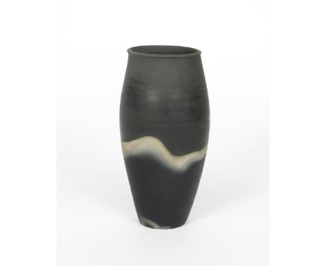 John Leach (born 1939) a Muchelney Pottery wood fired, burnished stoneware vase, swollen cylindrical form, decorated with a s