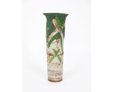 Robin Welch (born 1936) a cylindrical vase with everted top rim, painted and resist decorated in emerald green with cross mot