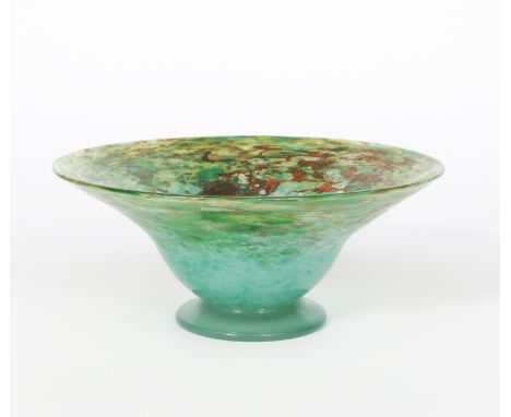 A Moncrieff's  Monart Ware glass bowl on applied foot, mottled green glass with a cloud of orange and aventurine applied pape