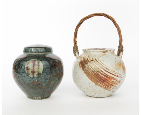 Lisa Hammond (born 1956) a  stoneware jar with woven akebe rush handle, ovoid with incised combed decoration glazed rust over
