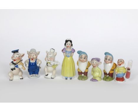 'Snow White and the Seven Dwarfs'  four Walt Disney Foreign tooth brush holder figures,  comprising Snow White, Dopey and two