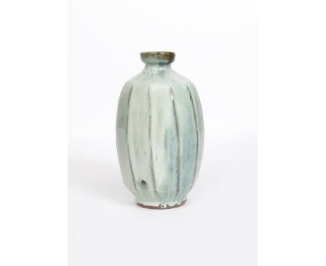 Mike Dodd (born 1943) a cut-sided stoneware bottle vase, covered to the foot in a hardwood ash glaze, impressed seal marks, 3