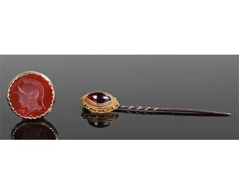 18 carat gold and garnet set stick pin, the garnet set to the mount with dot and rope twist boarder, together with a 9 carat 