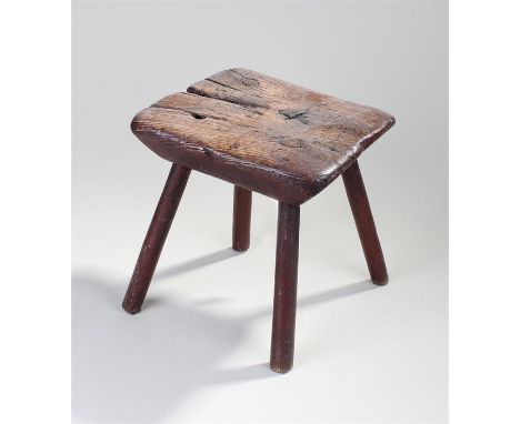 Small 19th Century elm stool, the shaped rectangular top above four red painted legs, 26cm x 24cm x 31cm