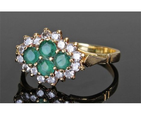 18 carat gold diamond and emeralds set ring, with four central emeralds, surrounded with sixteen diamonds, ring size S