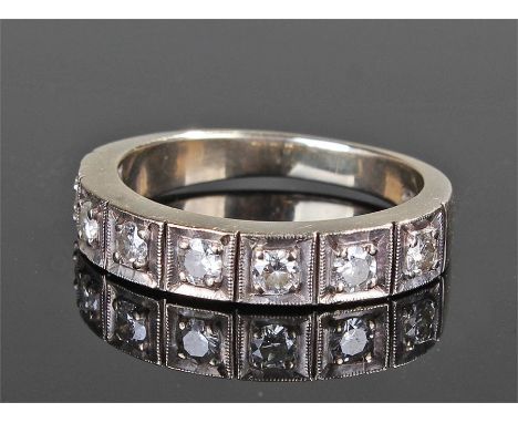 18 carat white gold diamond set ring, with a row of seven diamonds, ring size R