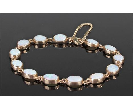 9 carat gold opal bracelet, set with thirteen oval opals, clasp end