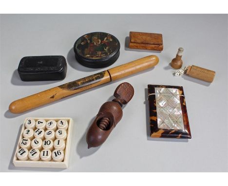 Mixed works of art, to include a nut cracker, a Victorian mother of pearl and tortoiseshell card case, a Mauchline ware needl