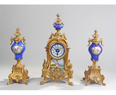 Late 19th Century French gilt spelter and porcelain mantel clock, the clock with a blue glaze urn above acanthus leaf and scr