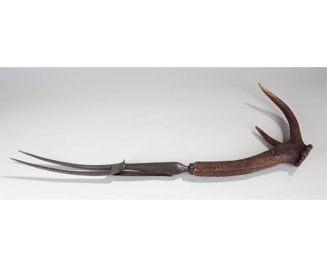 Victorian oversized advertising fork, the a stag antler handle and large fork prongs with guard, 80cm long
