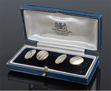 Pair of 18 carat gold and enamel cufflinks, the oval cufflinks with white line enamel, 17mm high, 7.7 grams