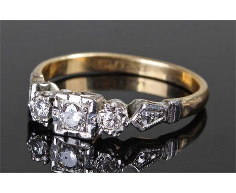 18 carat gold diamond set ring, with three diamonds to the platinum mount, ring size P 1/2