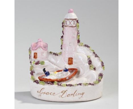 19th Century Staffordshire flatback, Grace Darling, modelled with two figures in a boat near a light house, 17cm high