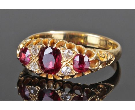 18 carat gold diamond and ruby ring, with three rubies and four diamonds, ring size Q