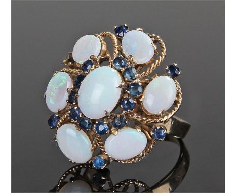 18 carat gold sapphire and opal ring, set with seven opals and sixteen sapphires, to empty sapphire mounts, all made to form 