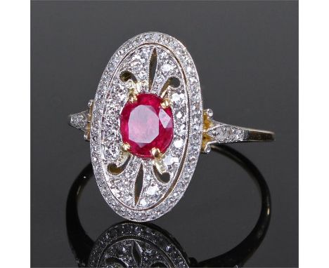 Yellow metal ruby and diamond ring, the central approximately 1 carat ruby within a diamond set pierced shield shape mount, r