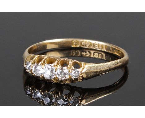 18 carat gold diamond set ring, with a row of five diamonds, ring size P