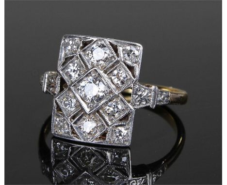 Art Deco 18 carat and diamond set ring, the rectangular panel set with eleven diamonds on a white metal mount, ring size O