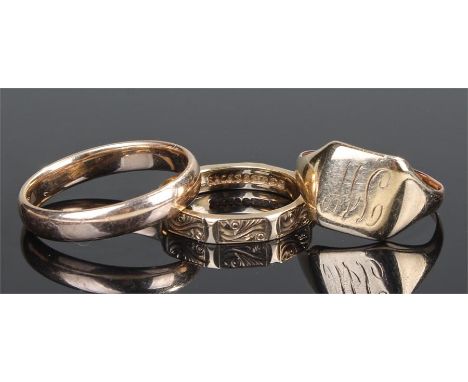 Three 9 carat gold rings, to include two wedding bands and a signet ring, total weight 9.2 grams