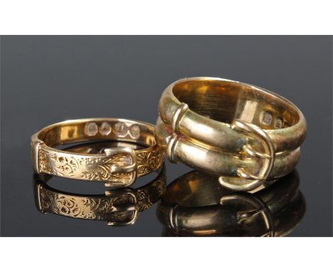 Two 18 carat gold buckle rings, the first a dual band, the second with etched design, total weight 7.3 grams, ring sizes M an