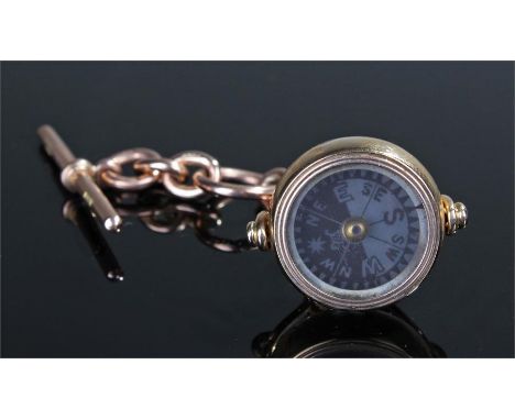 18 carat gold watch compass, the 9 carat gold T bar and chain, attached to an 18 carat gold mounted compass, 9cm high 