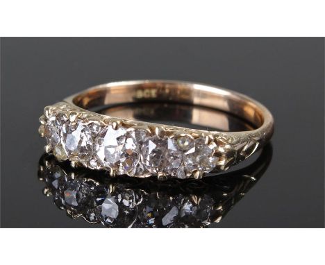 18 carat gold diamond set ring, with a band of five graduating diamonds, with a further eight diamonds to the corners, ring s