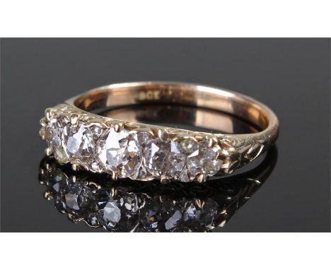 18 carat gold diamond set ring, with a band of five graduating diamonds, with a further eight diamonds to the corners, ring s