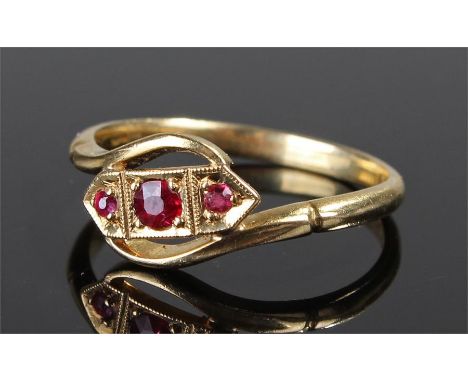 18 carat gold and ruby set ring, with three rubies set on an angled mount, ring size Q