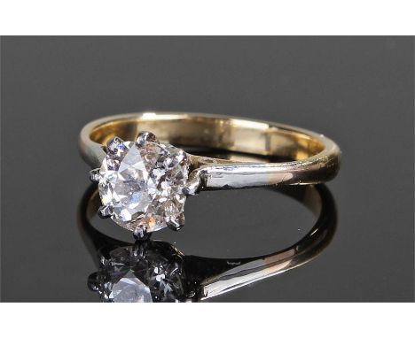 Yellow metal single stone diamond ring, the single diamond at approximately 1.2 carat, held in white metal claws, ring size M