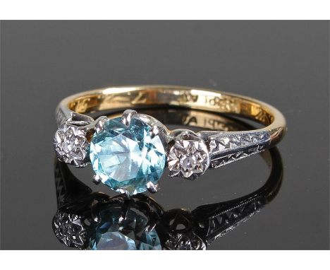 18 carat gold aquamarine and diamond set ring, the central aquamarine flanked by two diamonds, ring size M 1/2