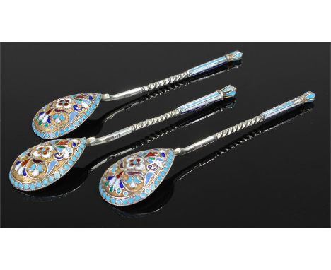 Set of three Russian silver and enamel spoons, each with polychrome enamels with flowers and scrolls, marked 84, 11.5xm long,