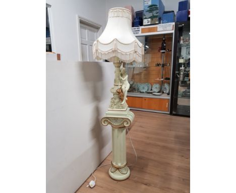 CREAM AND GILT LADY FIGURED TABLE LAMP AND SHADE ON GREEK COLUMN PEDESTAL STAND