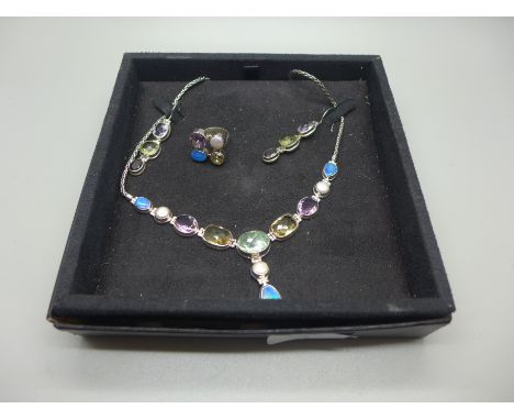 A silver designer gem set necklace, earrings and ring, stones include opal, amethyst, etc. 