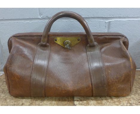 A vintage leather doctor's bag wtih key 