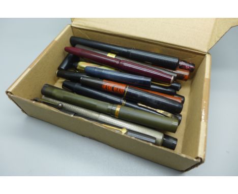 A box of vintage fountain pens, three with 14ct gold nibs 