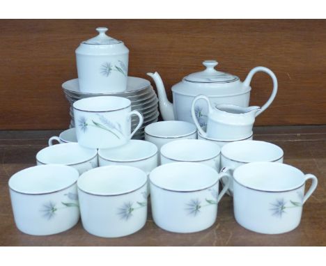 A Limoges Chandon Gris platinum edged hand painted coffee set, twelve cups, saucers, a cream jug, sugar pot and teapot **PLEA