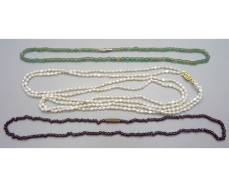 A pearl necklace, a garnet necklace and one other 