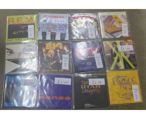Two boxes of 45 rpm 7" vinyl singles, mainly 1990s, Guns &amp; Roses, Michael Jackson, etc. 