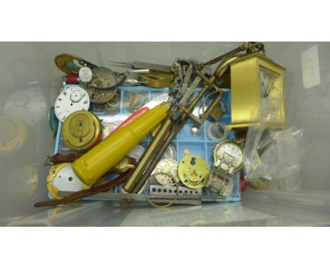 A collection of watch parts including dials, movements, watchmaker's tools, watches and a Swiza 8-day clock 