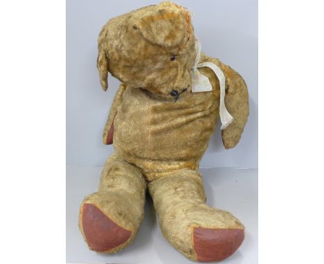 A large plush jointed straw filled vintage Teddy bear, a/f 