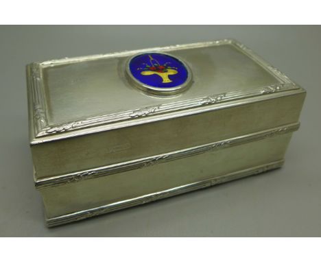 A Goldsmiths and Silversmiths heavy silver box, London 1923, decorated with enamel fruit basket to the lid, 210g 