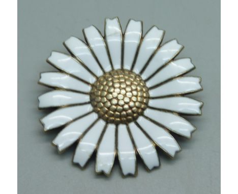 An Anton Michelsen silver and enamel daisy brooch, marked AM Denmark, 17g, enamel a/f, 4cm 
