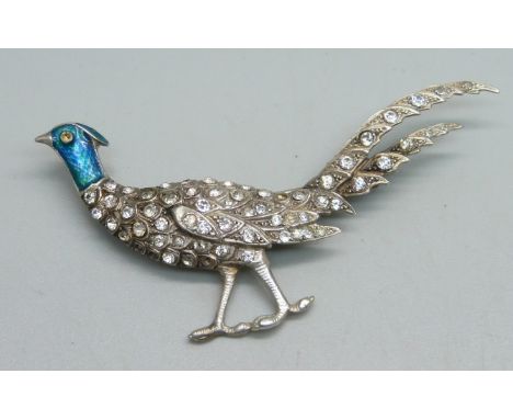 A French .935 silver and enamel brooch set with paste stones, 13g, 7.5cm, some stones missing 