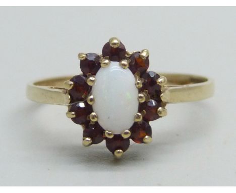 A 9ct gold, opal and garnet cluster ring, 1.5g, L 